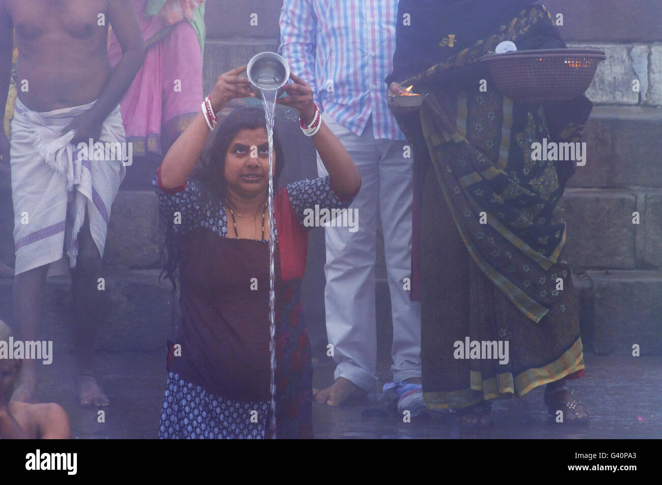 Unidentified Indian woman taking ritual bath in the river Ganges at ...