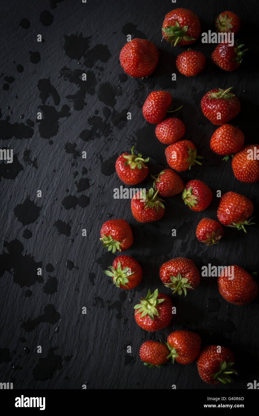 Strawberries on black slate. Top view Stock Photo
