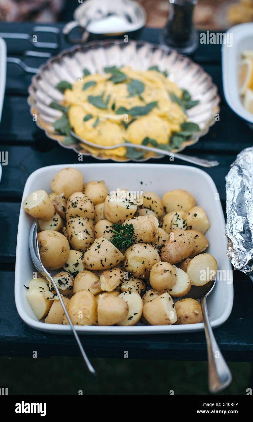 Boiled potatoes and homemade mayonnaise on a table for a summer lunch