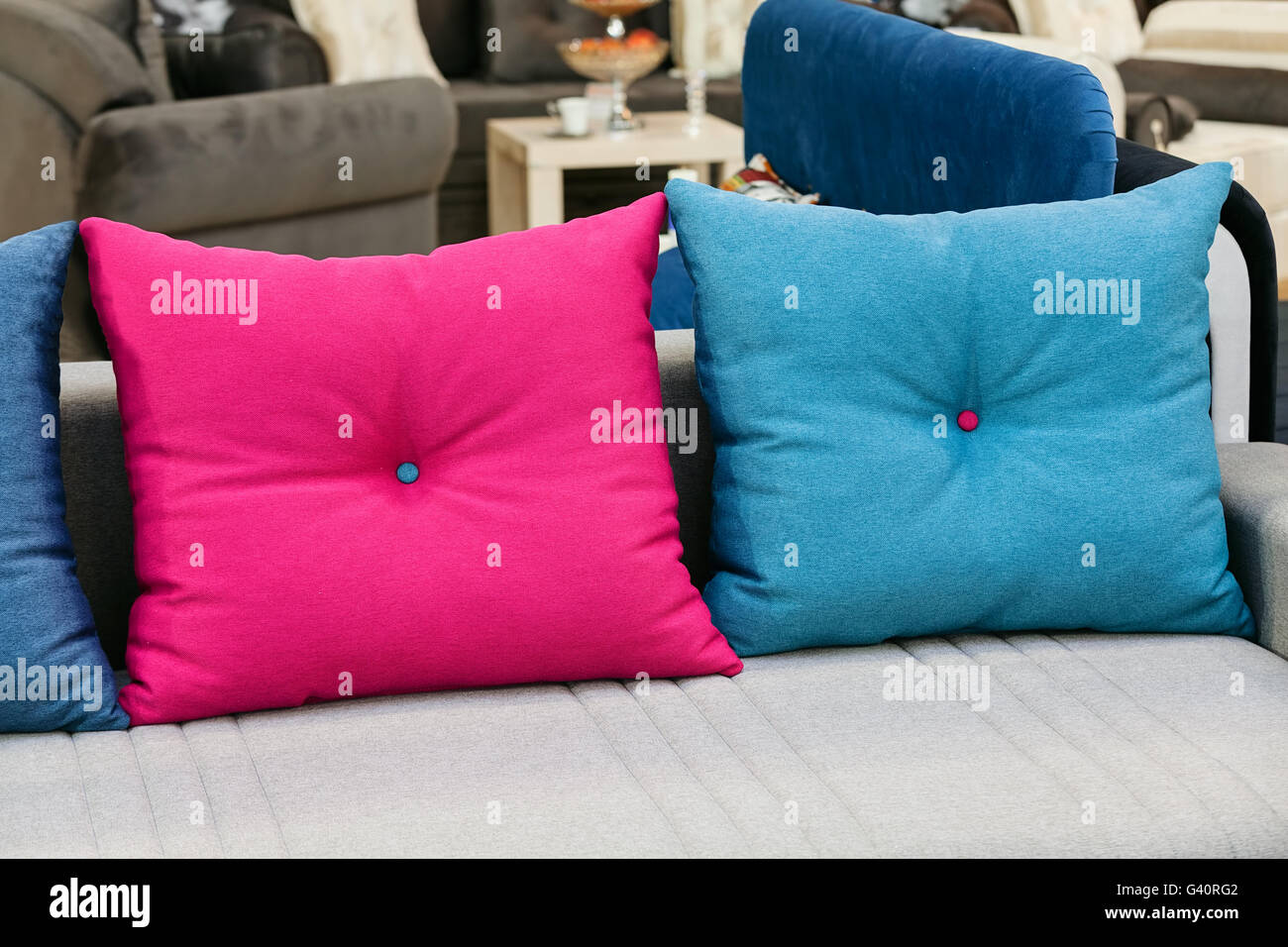 Pink and blue pillows on the couch Stock Photo Alamy