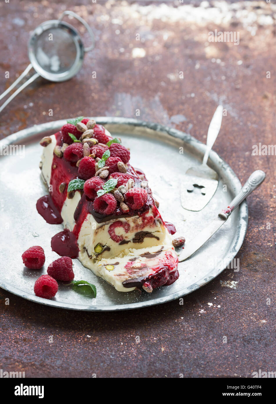 Semifreddo or italian cheese icecream dessert with pistachios, fresh