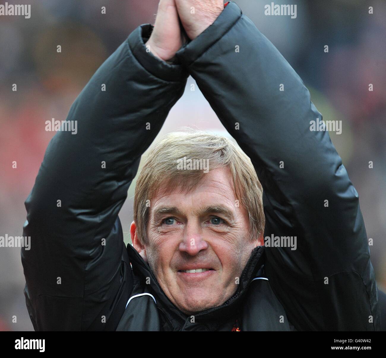 Soccer - FA Cup - Third Round - Manchester United v Liverpool - Old Trafford. Liverpool manager Kenny Dalglish applauds the fans before the match Stock Photo