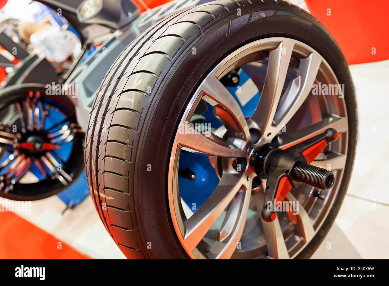 Car wheel service station and diagnostic equipment; note shallow depth