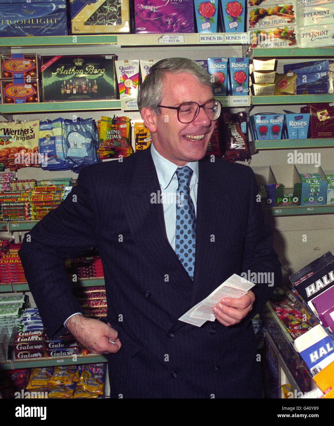 PAP 03: LONDON: 14.11.94: Prime Minister John Major after buying his selection of National Lottery numbers at a newsagents in Victoria, London, this morning (Monday). The National Lottery was launched with a series of spectacular dawn fireworks displays today and early morning business from would-be millionaires was brisk with queues forming to buy tickets. Stock Photo