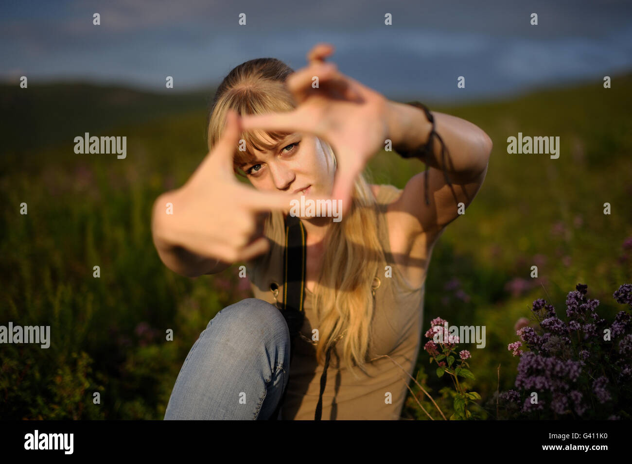 A photographer woman framing with fingers. Stock Photo