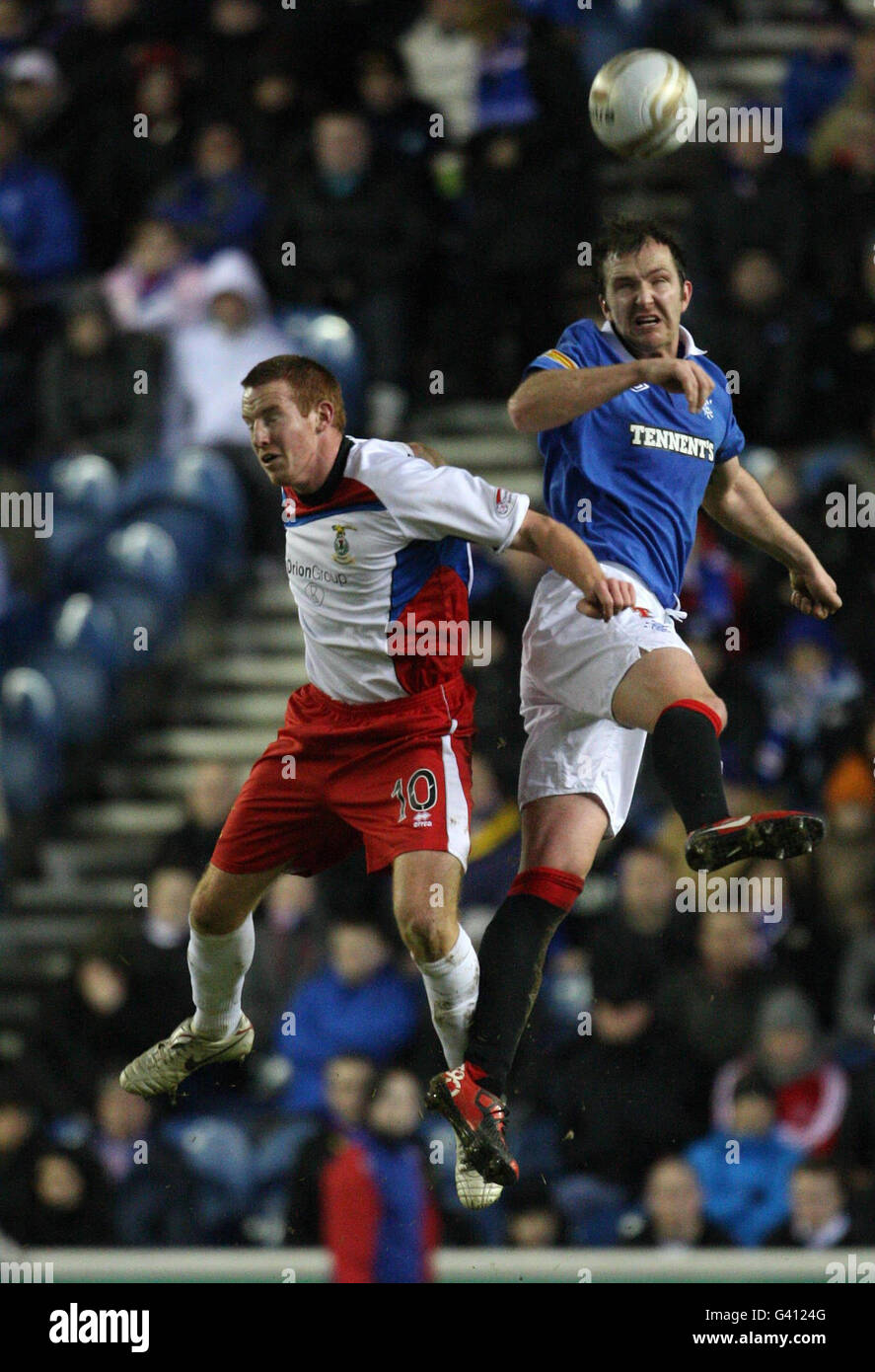 Rangers' Andy Webster and Inverness' Adam Rooney (left) battle for the ...