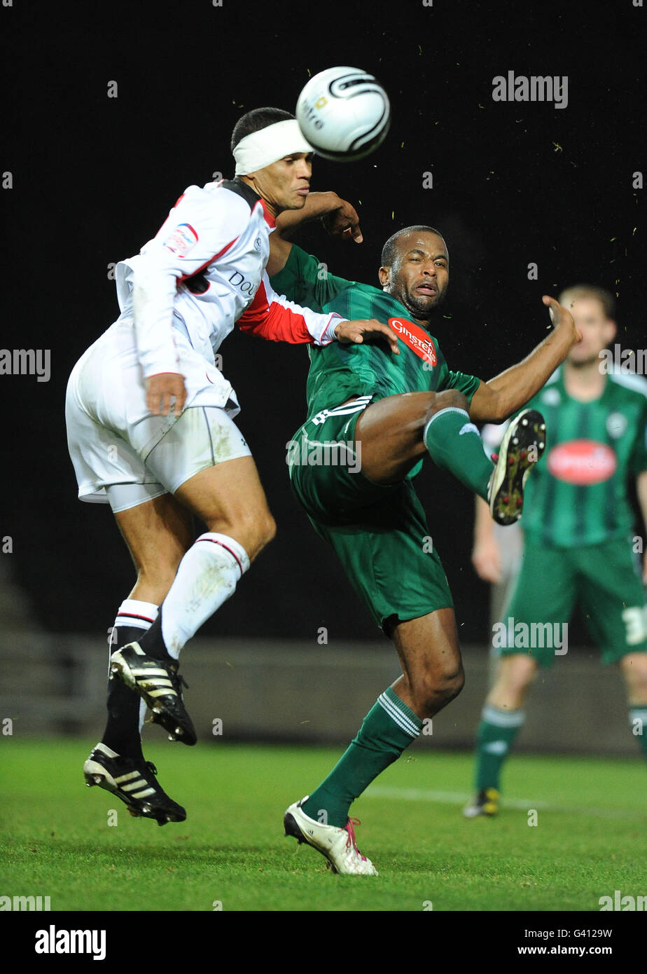 Milton Keynes Dons' Mathias Kouo-Doumbe and Plymouth Argyle's Stephane Zubar Stock Photo