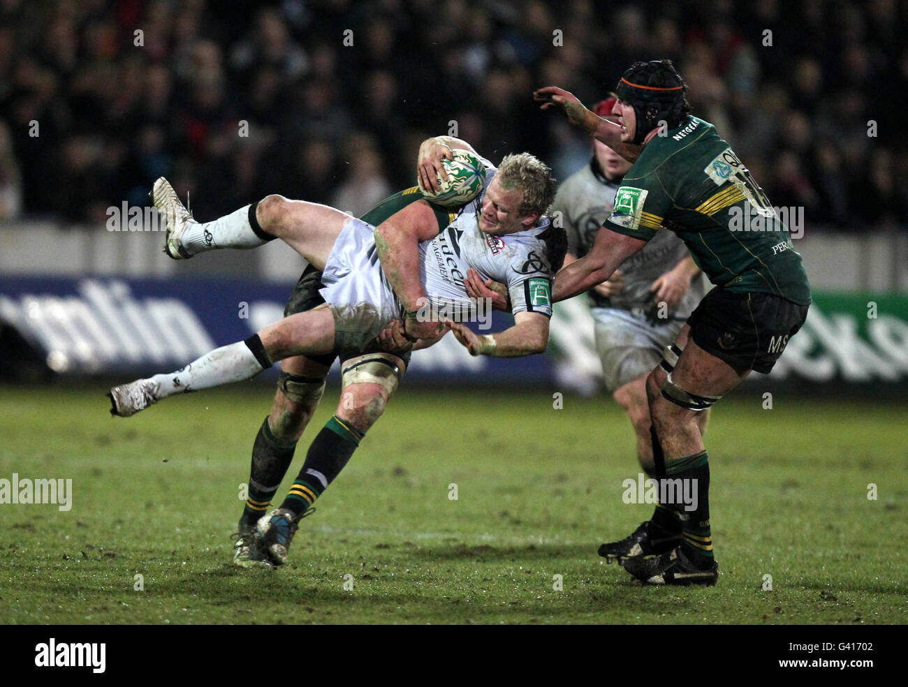 Edinburgh Rugby's James King is tackled by Northampton Saints Phil Dowson Stock Photo