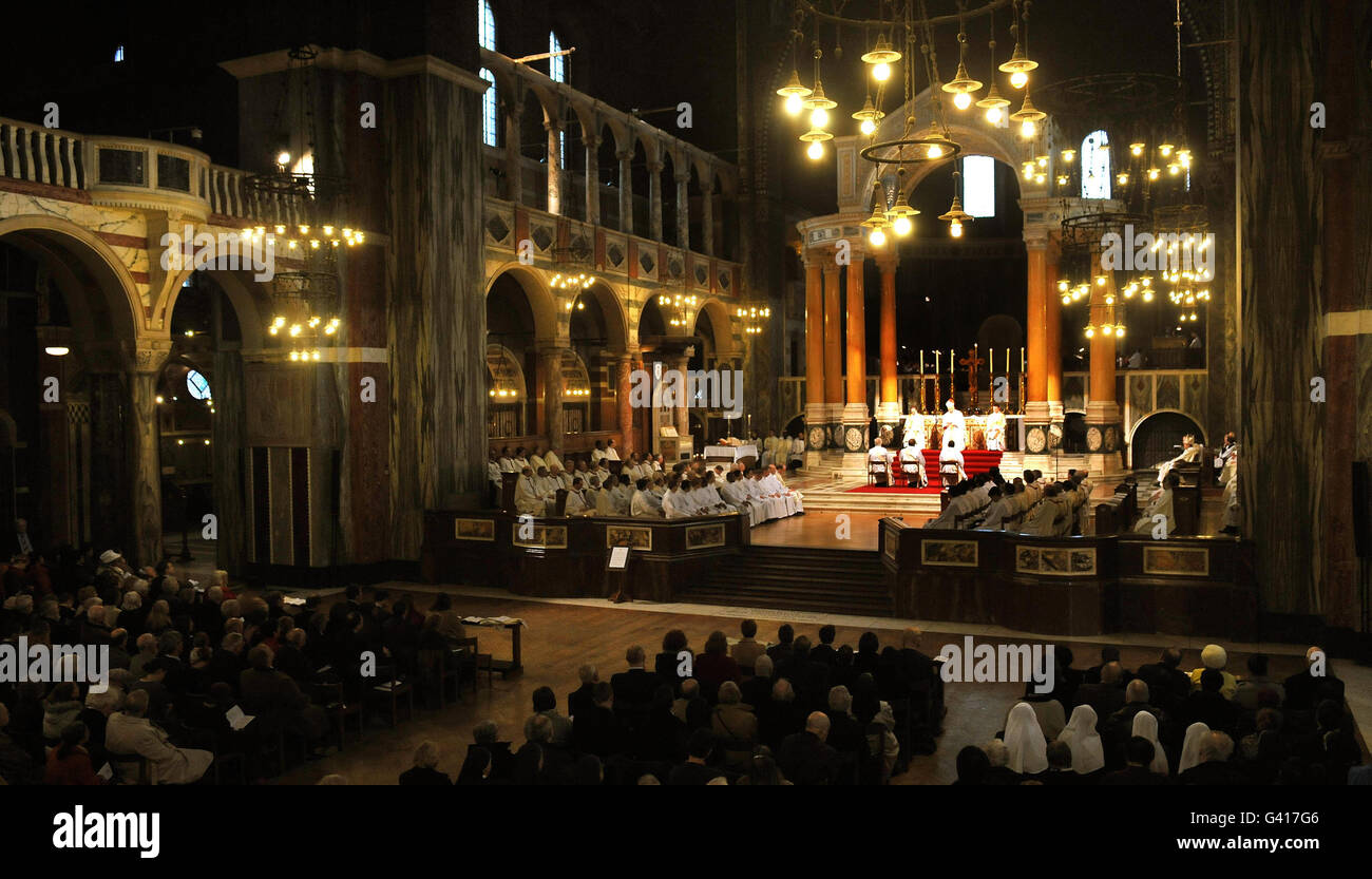A general view of the ordination of three former Anglican bishops, John Broadhurst, former bishop of Fulham, Andrew Burnham, former bishop of Ebbsfleet, and Keith Newton, ex-bishop of Richborough, in Westminster Cathedral, London. Stock Photo