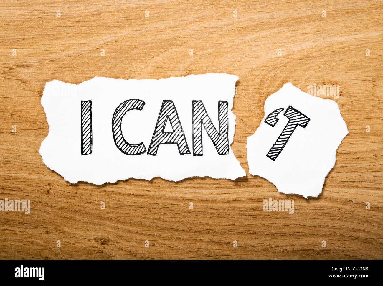 I can or I can't: two pieces torn paper with contrast messages Stock Photo