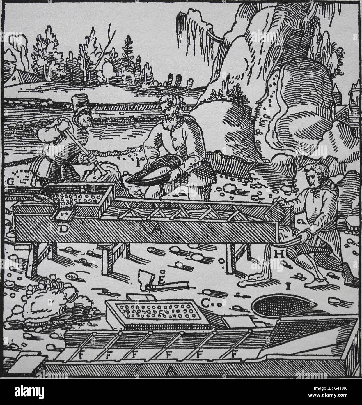 George Agricola (1494-1555) . Book De Re Metallica, 1556. Book VIII. Wash ore. Engraving by Basilius Weffring. A.Sluice. B.Box. Stock Photo