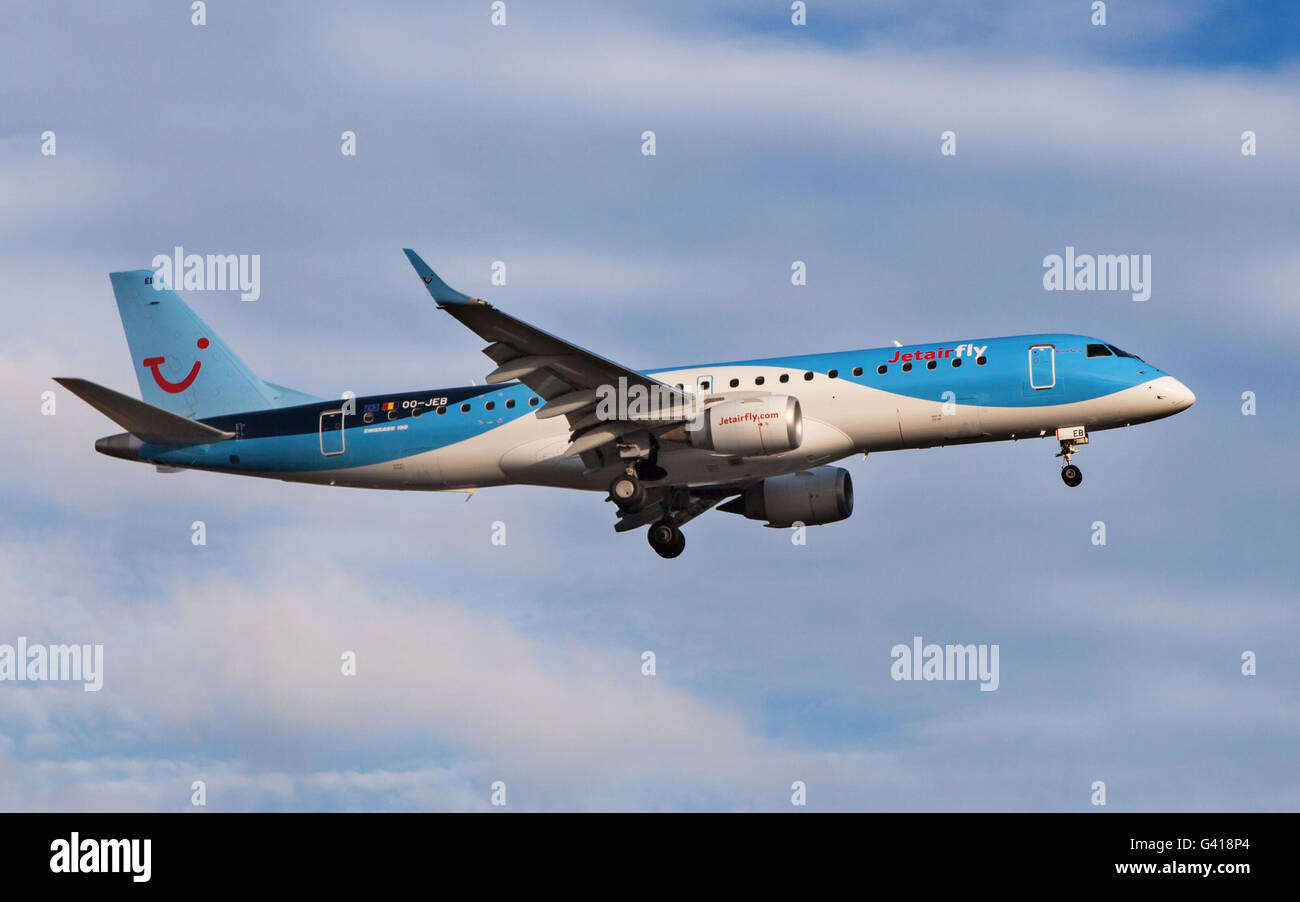A Jetairfly Embraer ERJ-190STD approaching to El Prat Airport in Barcelona, Spain. Stock Photo