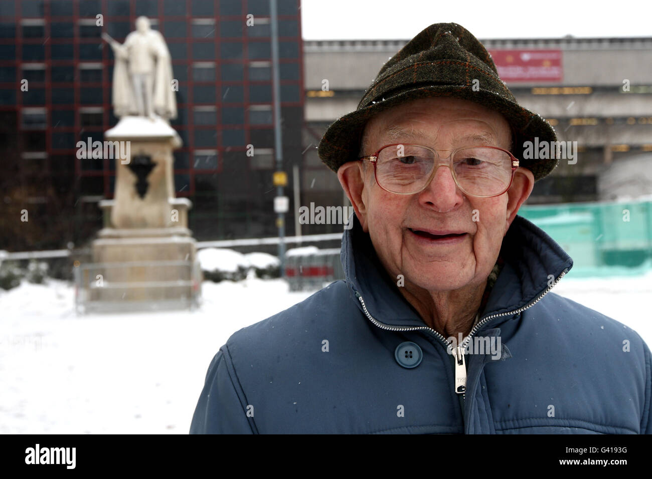 Mr. Greenfield stands in front of the newly restored statue of Edward VII, which was due to be unveiled by the Prince of Wales today, but was cancelled after snowfall in the midlands. Stock Photo