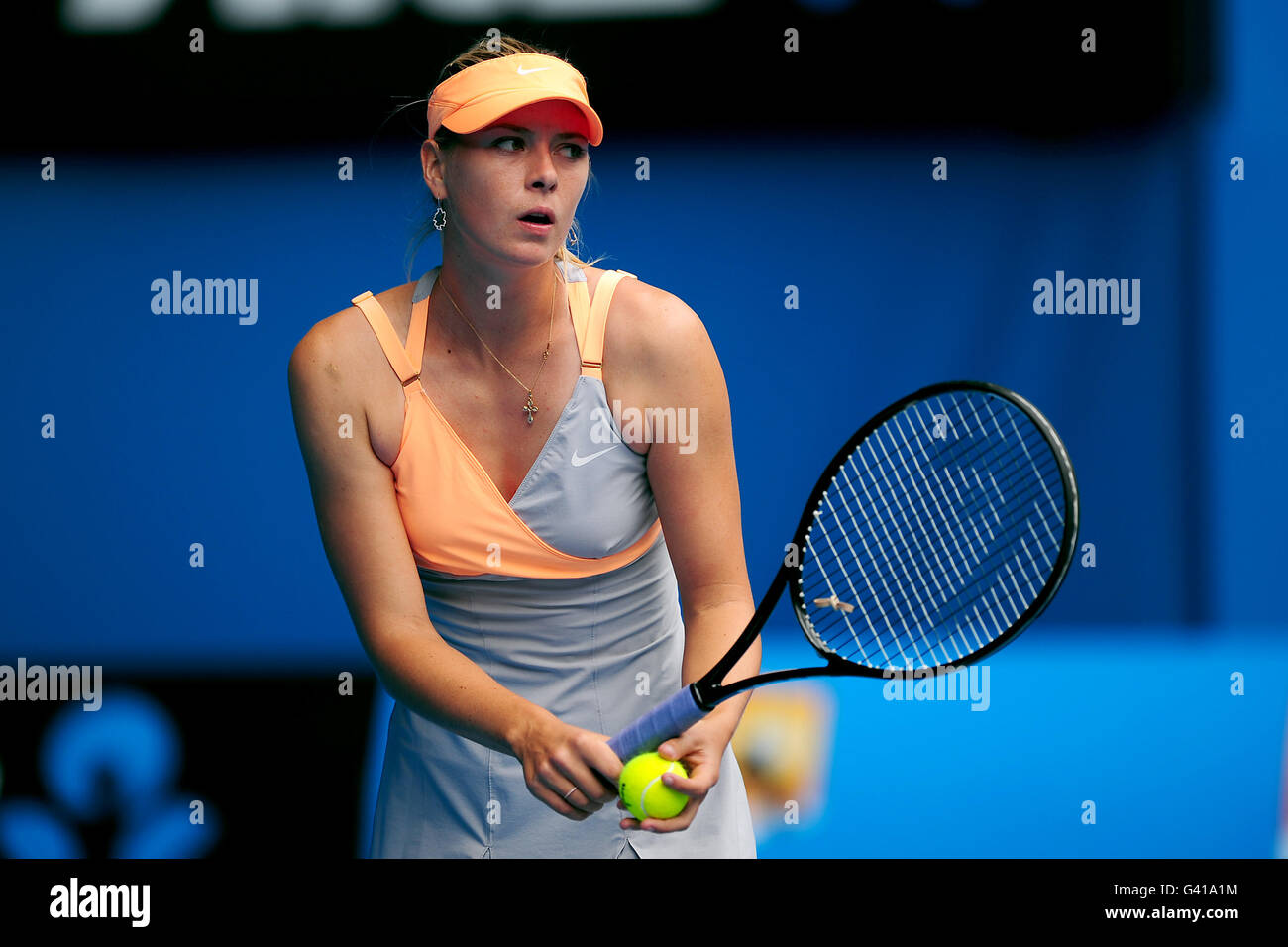 Tennis - 2011 Australian Open - Day One - Melbourne Park. Russia's Maria Sharapova in action against Thailand's Tamarine Tanasugarn Stock Photo
