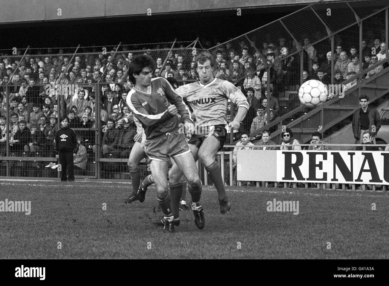 Soccer - Today League Division One - Chelsea v Sheffield Wednesday - Stamford Bridge. Chelsea's Steve Clarke (l) clears the ball under pressure from Sheffield Wednesday's Gary Megson (r). Stock Photo