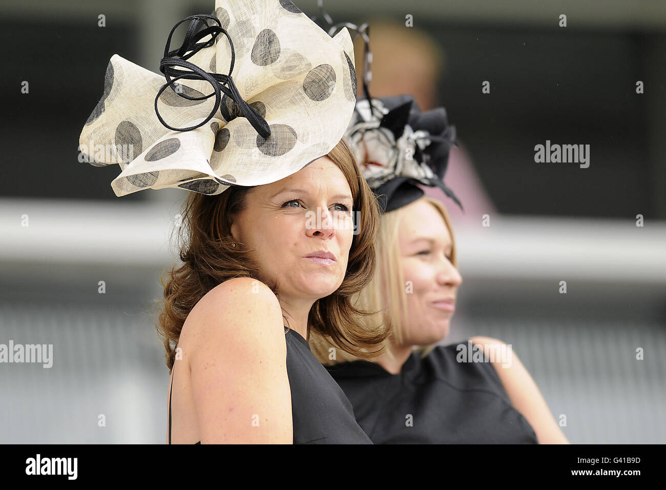 Horse Racing - The Investec Derby Festival - Ladies Day - Epsom Racecourse. Female racegoers during The Investec Ladies Day Stock Photo