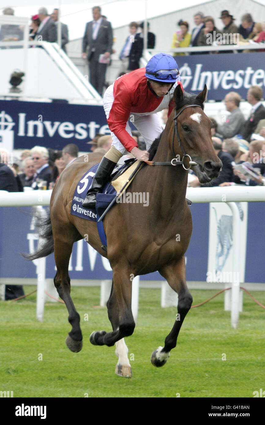 Horse Racing - The Investec Derby Festival - Ladies Day - Epsom Racecourse. Phillipina ridden by Ryan Moore Stock Photo