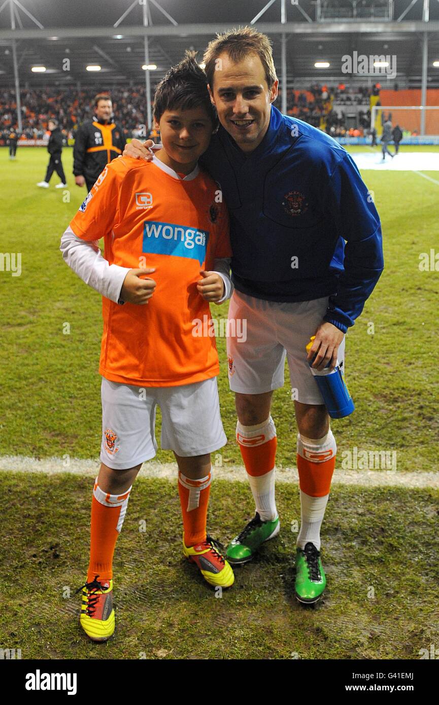 Blackpools luke varney poses with a match day mascot before kick off hi
