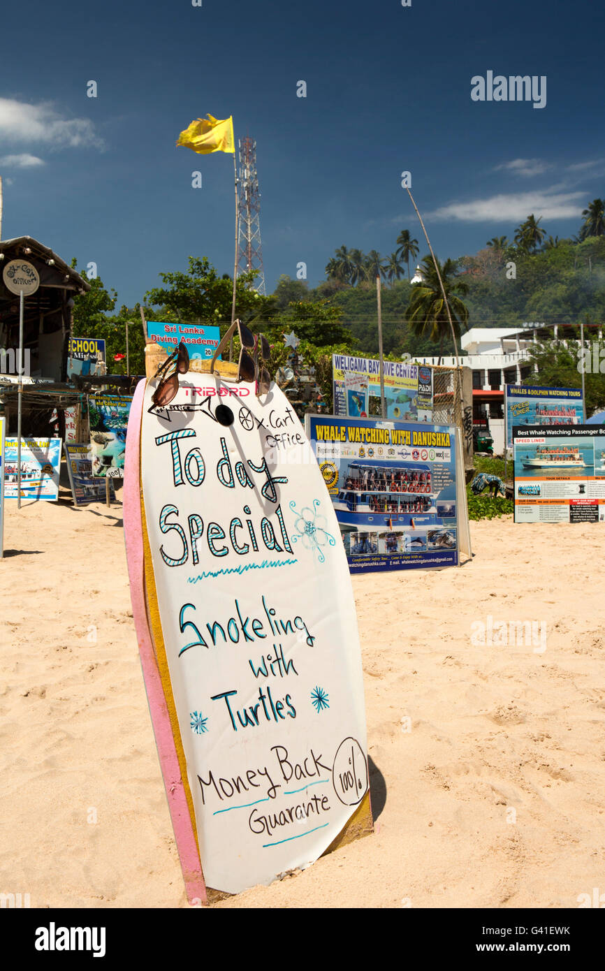 Sri Lanka, Mirissa beach, snorkeling with turtles excursion sign on surfboard Stock Photo