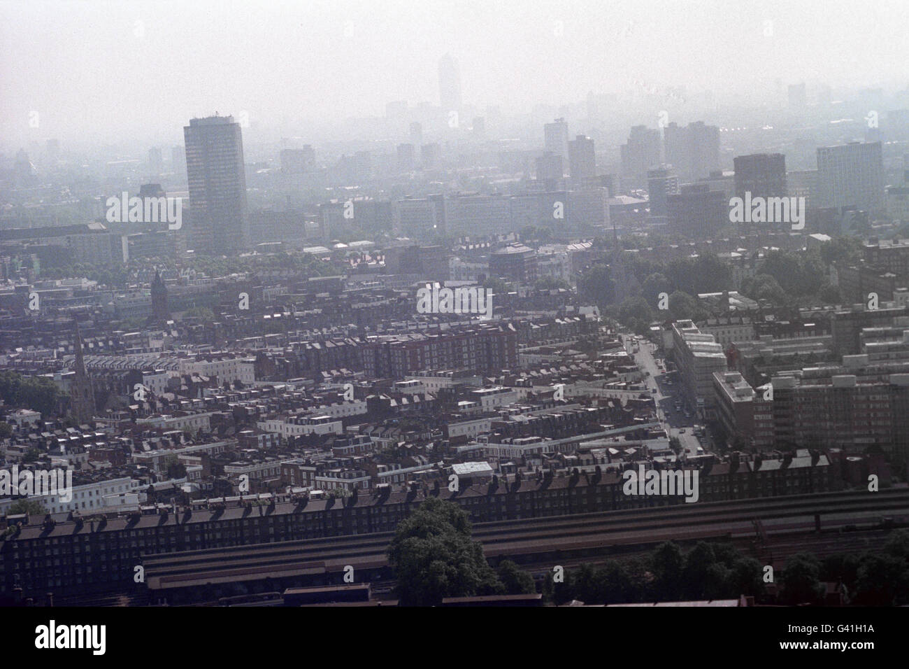 Pollution in London. Canary Wharf (centre back) is hardly visible through the haze over London. Stock Photo