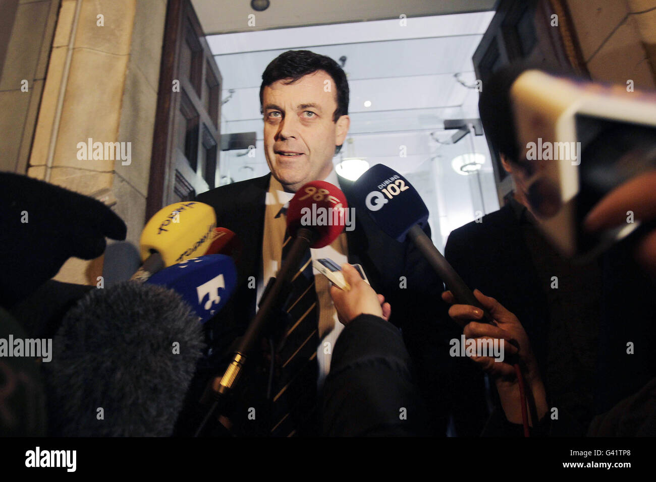 Finance Minister Brian Lenihan speaking to the media outside the Finance department on Merrion row in Dublin. Ireland's minority Government tonight secured support from the Opposition parties to pass the Finance Bill and dissolve parliament next week. Stock Photo