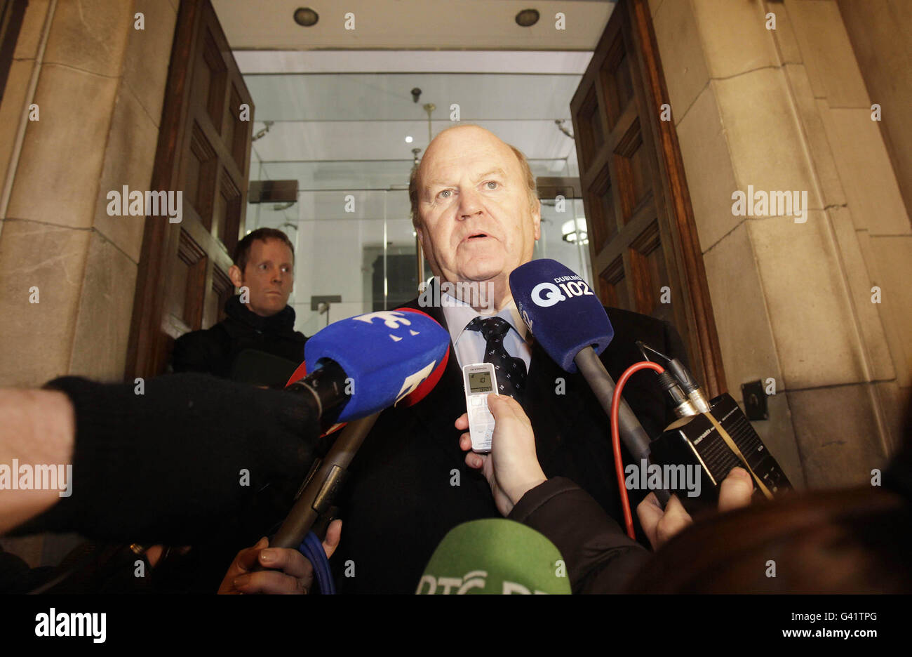 Fine Gael's Michael Noonan speaking to the media outside the Finance department on Merrion row in Dublin. Ireland's minority Government tonight secured support from the Opposition parties to pass the Finance Bill and dissolve parliament next week. Stock Photo