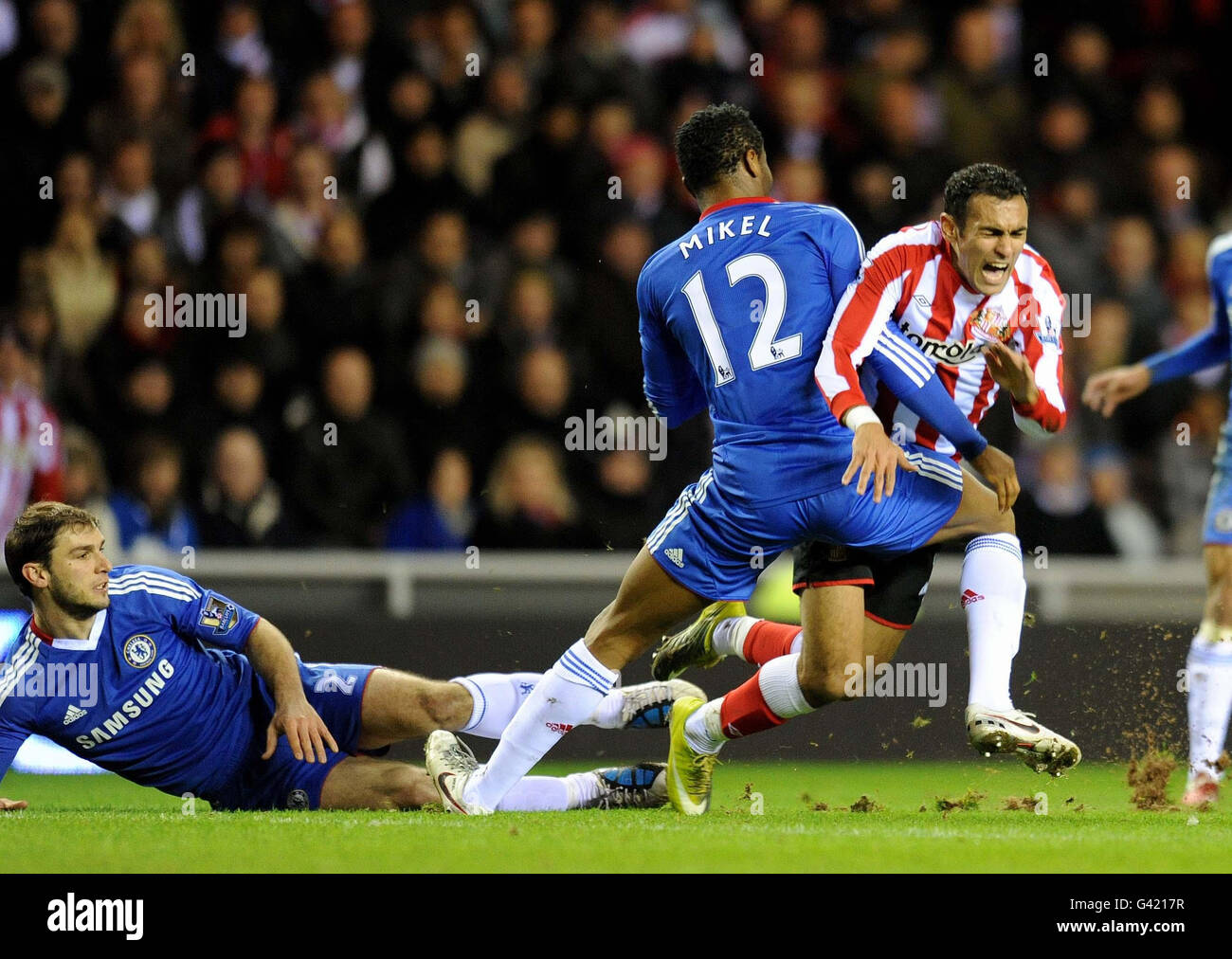 Sunderland's Ahmed Elmohamdy (right) is fouled by Chelsea's John Obi Mikkel, which lead to a free kick for Sunderland from which Kieran Richardson scored during the Barclays Premier League match at the Stadium of Light, Sunderland. Stock Photo