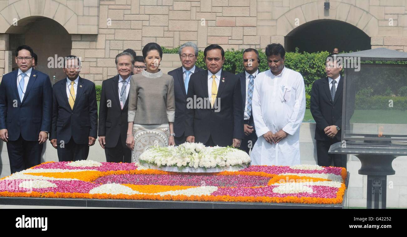 New Delhi, India. 17th June, 2016. Thai Prime Minister General Prayut Chan-o-cha, center, accompanied by his wife Naraporn pauses after placing a wreath at the memorial to Mahatma Gandhi at Rajghat June 17, 2016 in New Delhi, India. Credit:  Planetpix/Alamy Live News Stock Photo