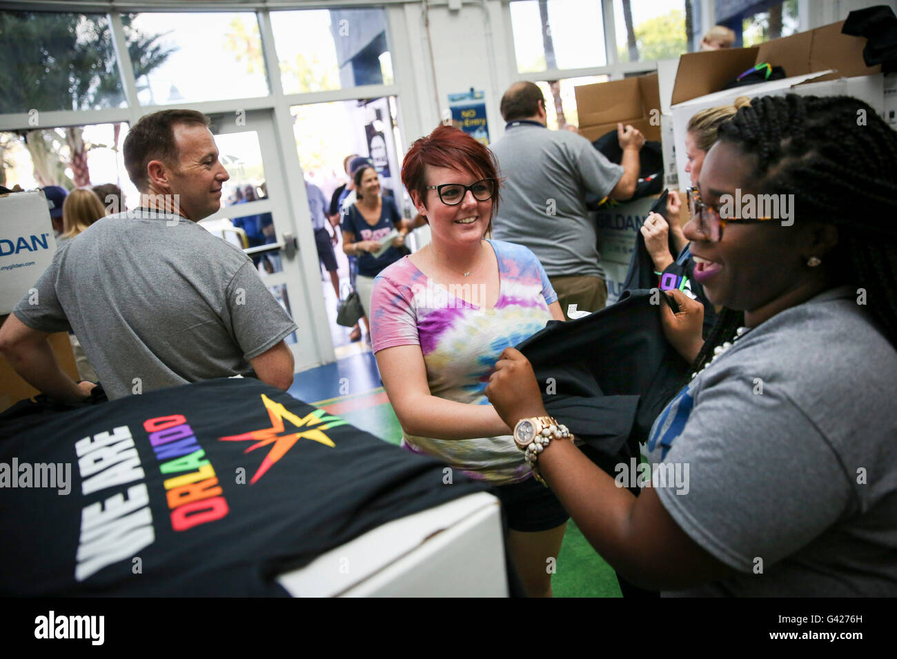 St. Petersburg, Florida, USA. 17th June, 2016. WILL VRAGOVIC | Times.Janelle Mahaffey, 30, center, of St. Petersburg takes a We Are Orlando shirt from Amber Mosley, right, with Rays Communications in the Rotunda at Gate 1 before the start of the game between the San Francisco Giants and the Tampa Bay Rays at Tropicana Field in St. Petersburg, Fla. on Friday, June 17, 2016. © Will Vragovic/Tampa Bay Times/ZUMA Wire/Alamy Live News Stock Photo