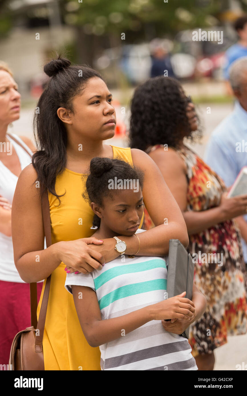 Charleston, United States. 18th June, 2016. Residents embrace during a memorial service for the Charleston Nine outside the Mother Emanuel African Methodist Episcopal Church on the anniversary of the mass shooting June 18, 2016 in Charleston, South Carolina. Nine members of the church community were gunned down during bible study inside the church on June 17, 2015. Credit:  Planetpix/Alamy Live News Stock Photo