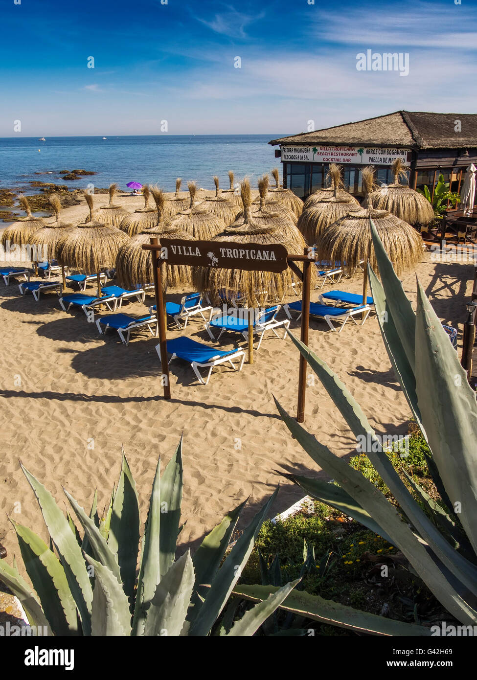 Villa Tropicana Chiringuito, beach restaurant and umbrellas. Mijas Costa, Malaga province, Costa del Sol, Andalusia, Spain Stock Photo