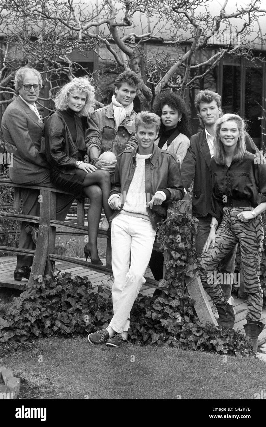 Norwegian Pop group A-Ha are recording the title song for the James Bond film 'The Living Daylights', starring Timothy Dalton. Members of the Bond team in London are Composer John Barry (glasses), bond girls Karen Seeberg (sitting), Femi (dark hair) and Trishi (right). A-Ha members are Morten Harket (scarf), Pal Waaktaar (front) and Magne Furuholmen (2nd r). Stock Photo