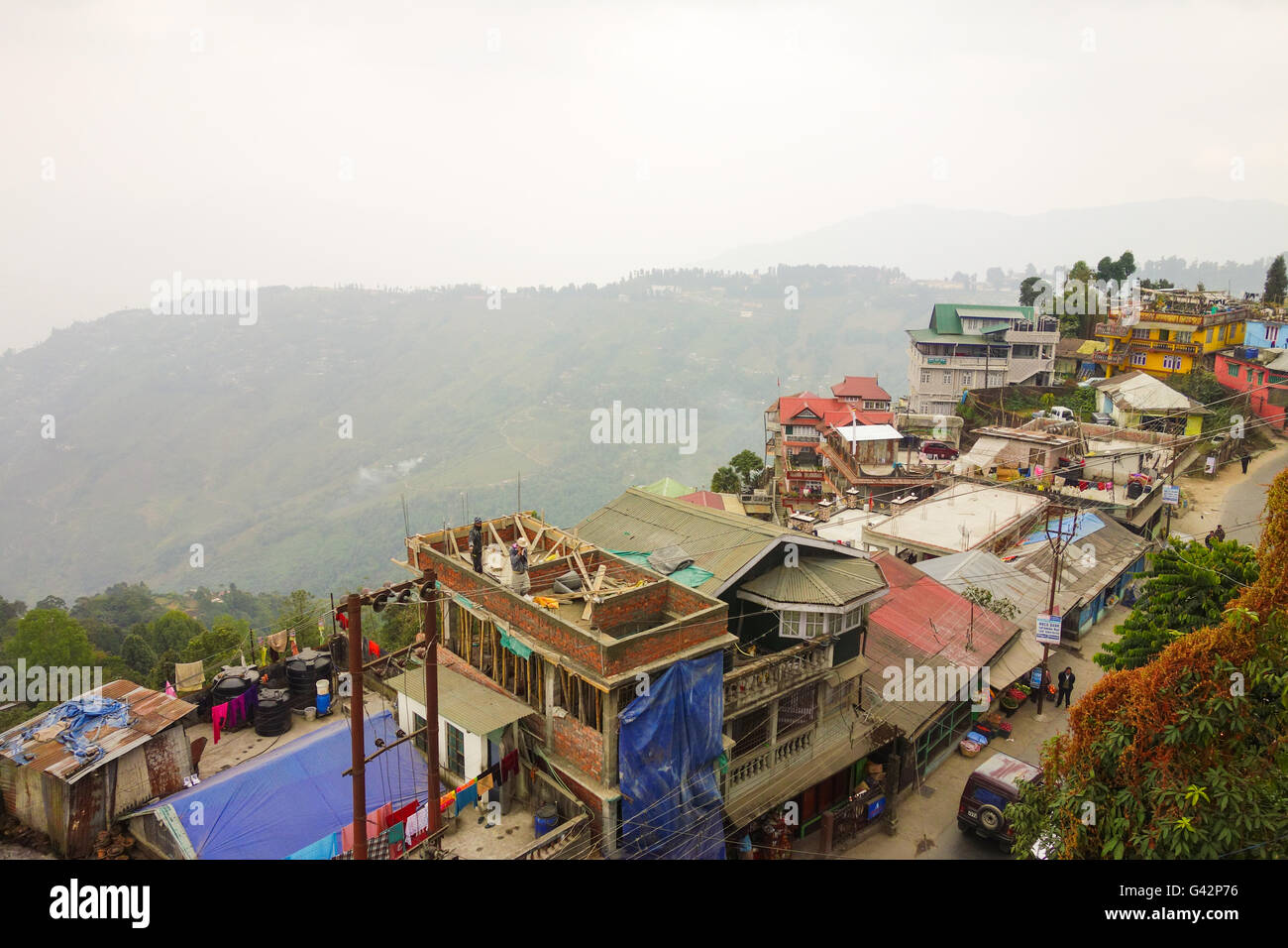View from Darjeeling Ropeway - Cluster of old houses in the mist in Darjeeling, West Bengal, India Stock Photo