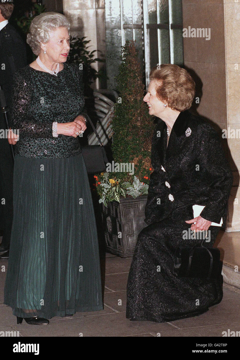 Baroness Thatcher curtsies to the Queen on her arrival at Claridge's in London for a glittering dinner last night (Monday) to celebrate the former Prime Minister's 70th birthday Baroness Thatcher greeted the Queen warmly, laying to rest past speculation that the two women did not get on with each other. See PA Story ROYAL Thatcher. Photo by David Cheskin/PA 07/03/98: The traditional curtsey could soon disappear, in a round of reforms to further modernise the monarchy, announced today (Saturday). The proposals include restricting the style His or Her Royal Highness to senior royals; confirming Stock Photo