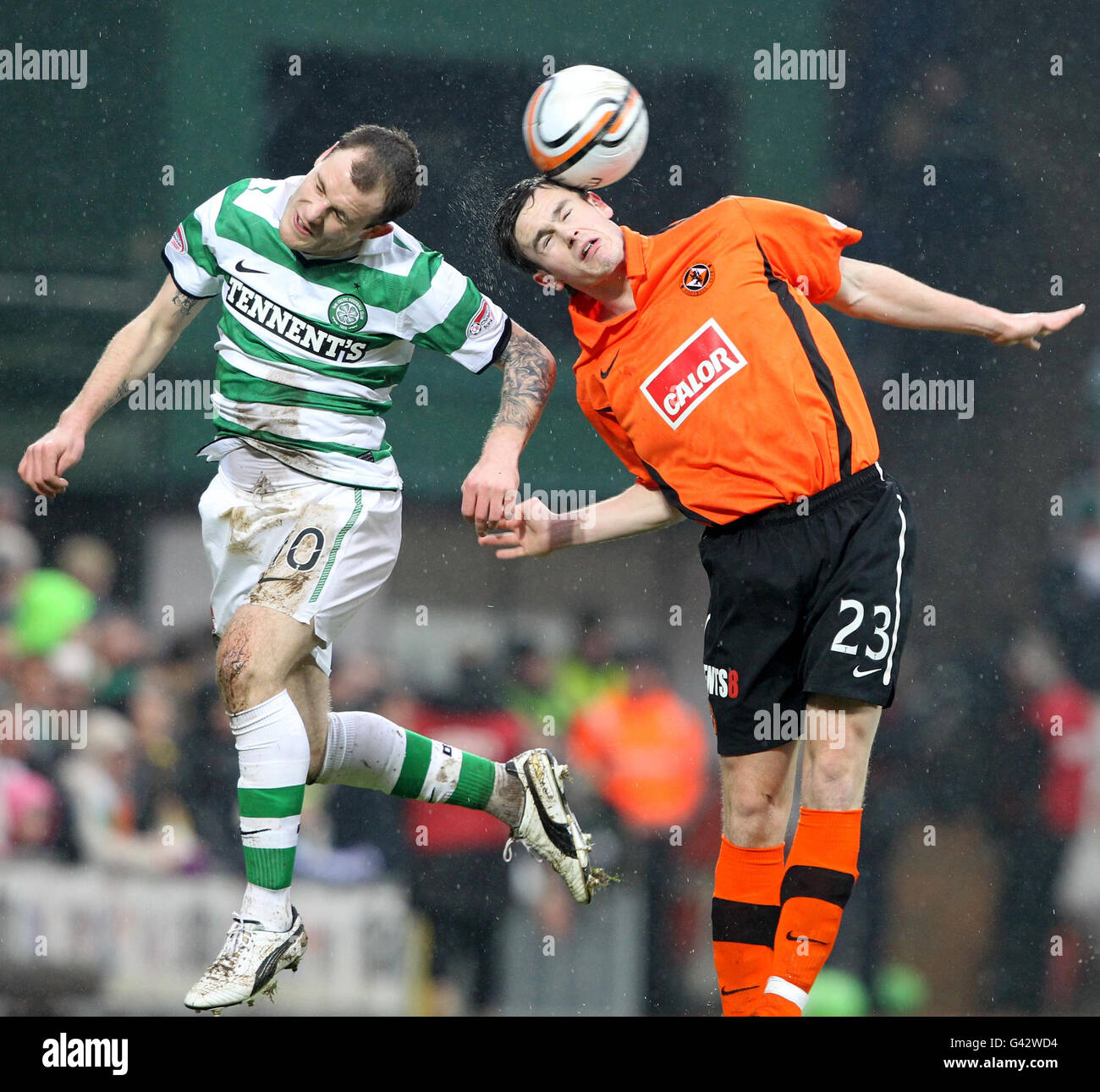 Celtic's Anthony Stokes (left) challenges Dundee United's Keith Watson during the Clydesdale Bank Scottish Premier League match at Tannadice Park, Dundee. Stock Photo