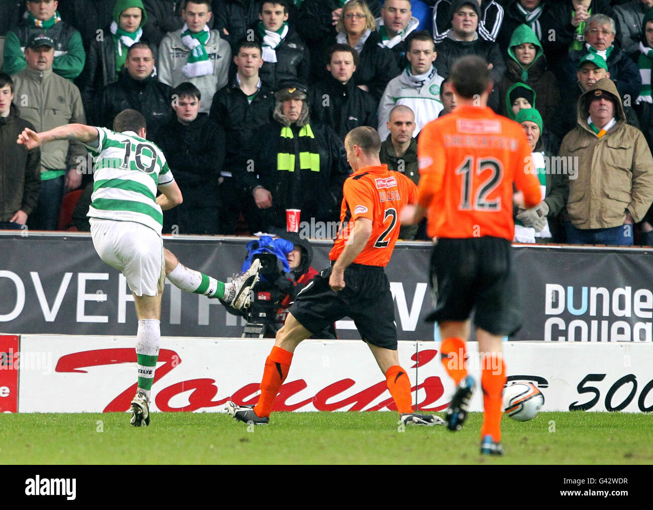 Celtic's Anthony Stokes scores his sides firs goal of the game during the Clydesdale Bank Scottish Premier League match at Tannadice Park, Dundee. Stock Photo