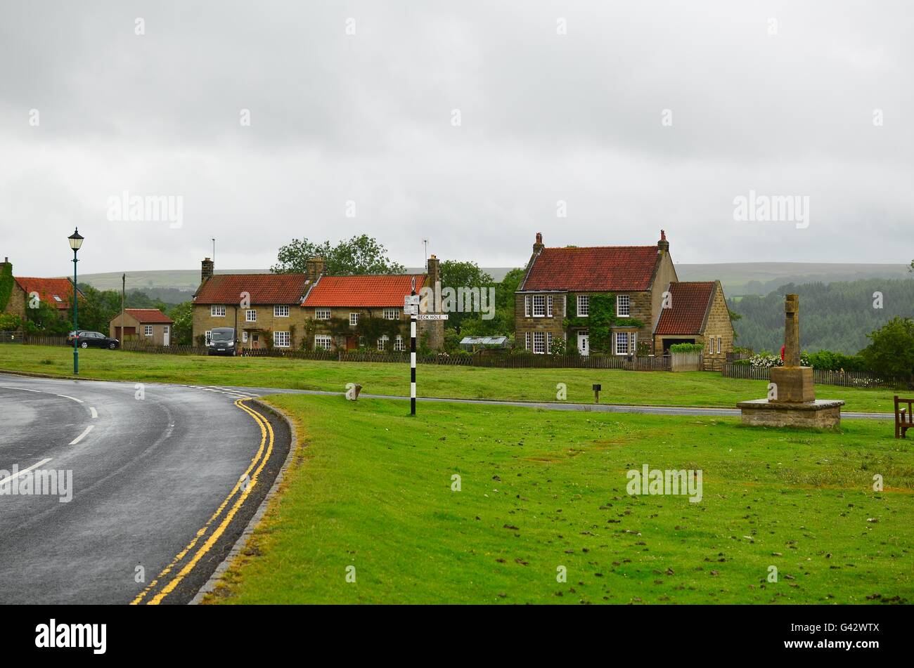 Village green with traditional stone cottages Goathland North Yorkshire Moors 'National Park' Fictional village of Aidensfield. Stock Photo