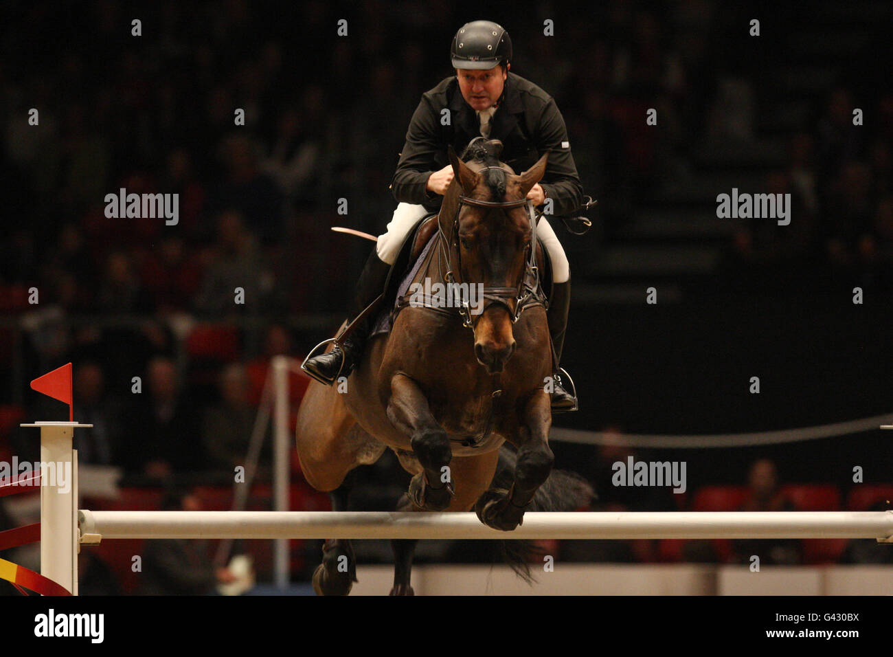 Great Britain's Robert Smith riding Raging Bull Vangelis S during the London International Horse Show at the Olympia Exhibition Centre, London. Stock Photo