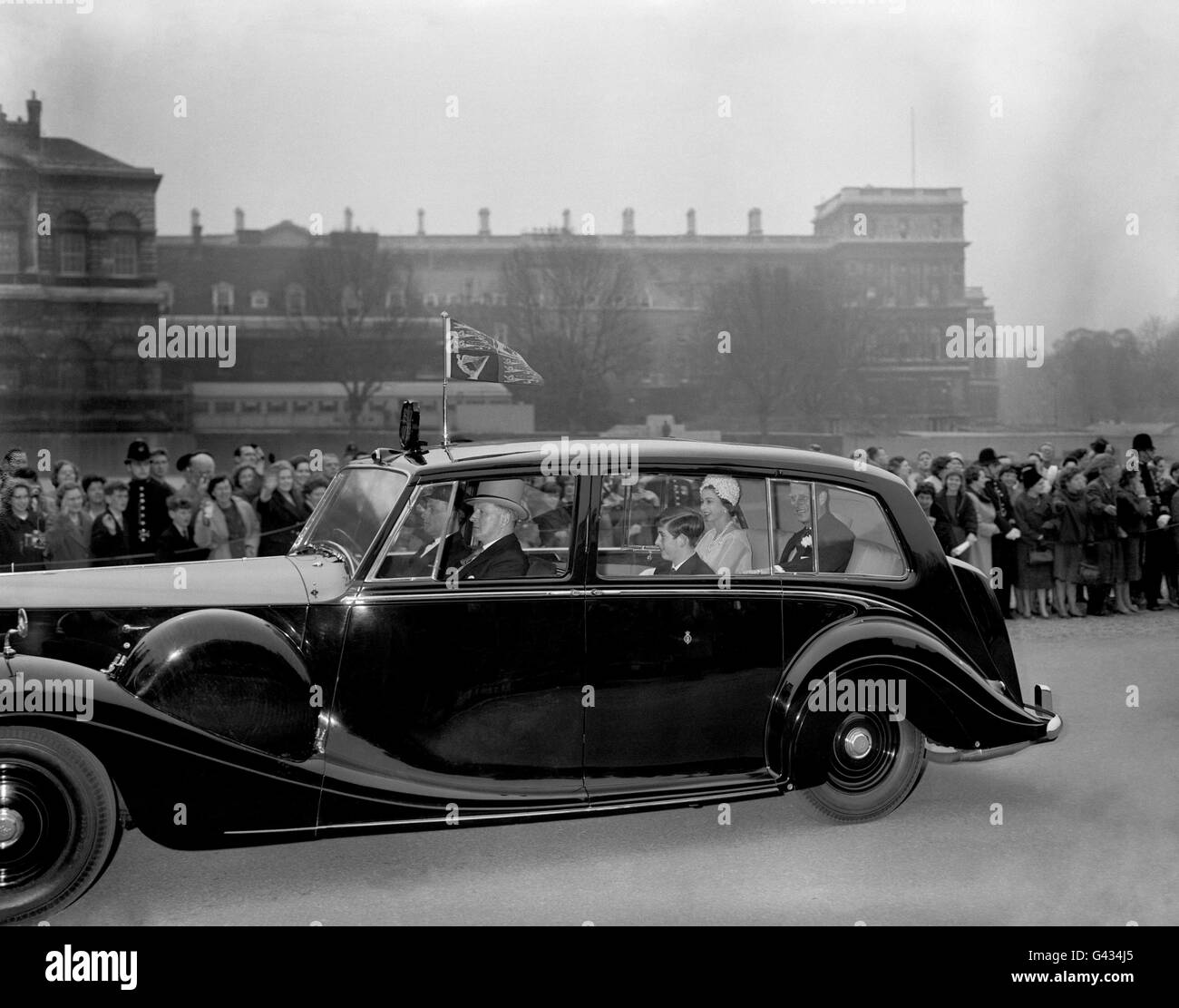 Queen Elizabeth II, the Duke of Edinburgh and Prince Charles, driving across Horse Guards Parade en route to Westminster Abbey for the wedding of Princess Alexandra and Angus Ogilvy Stock Photo