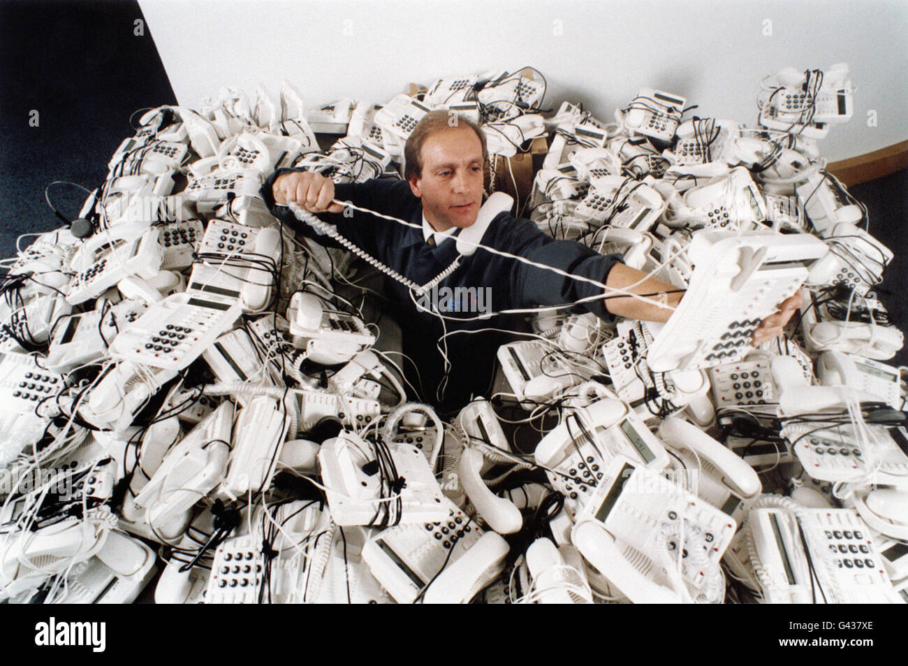 Engineer Alan Dillon has a few crossed wires as hundreds of telephones arrive at the BT Tower in London, ready for the annual Children In Need Appeal on Friday (Nov 24). The Tower is nerve-centre for the appeal, dealing last year with 300,000 calls from people wanting to pledge money. Stock Photo