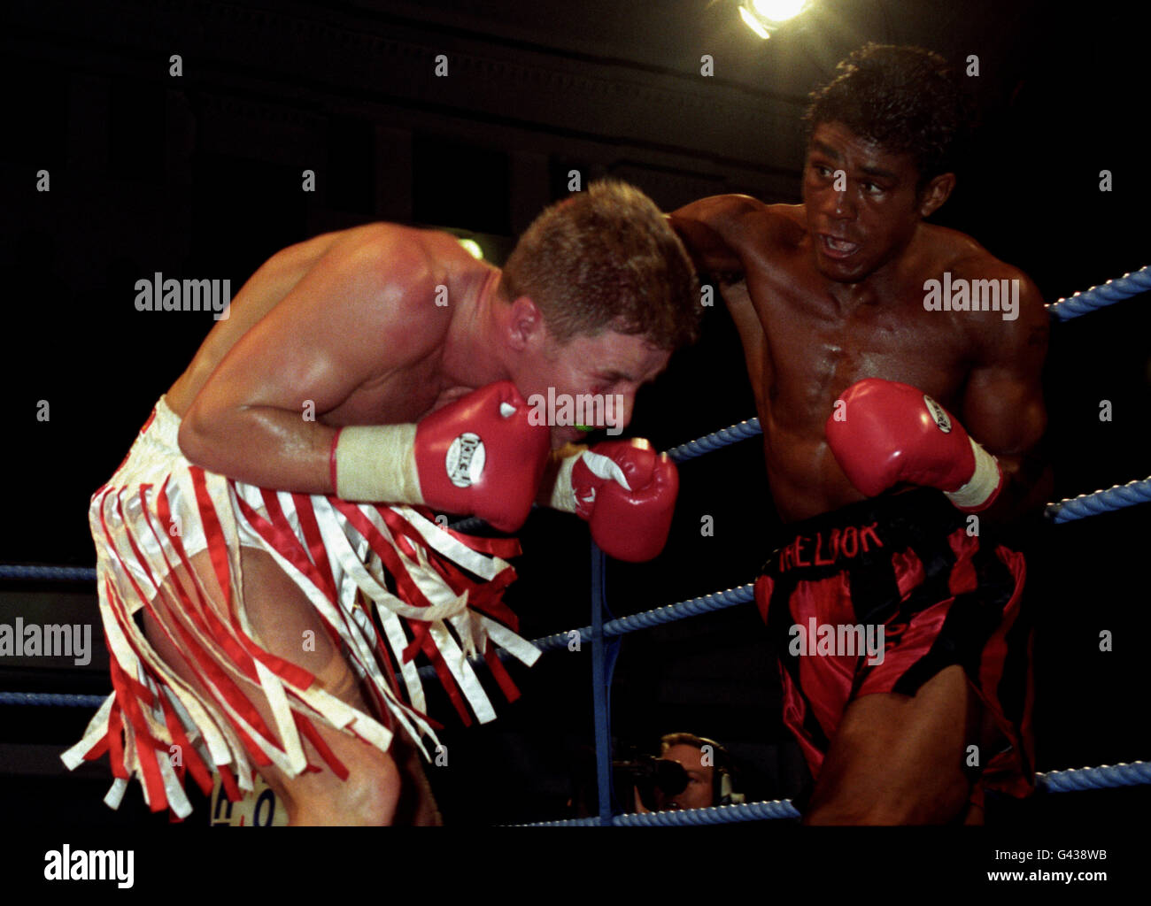 Challenger Kevin Lueshing lands a right to the head of defending