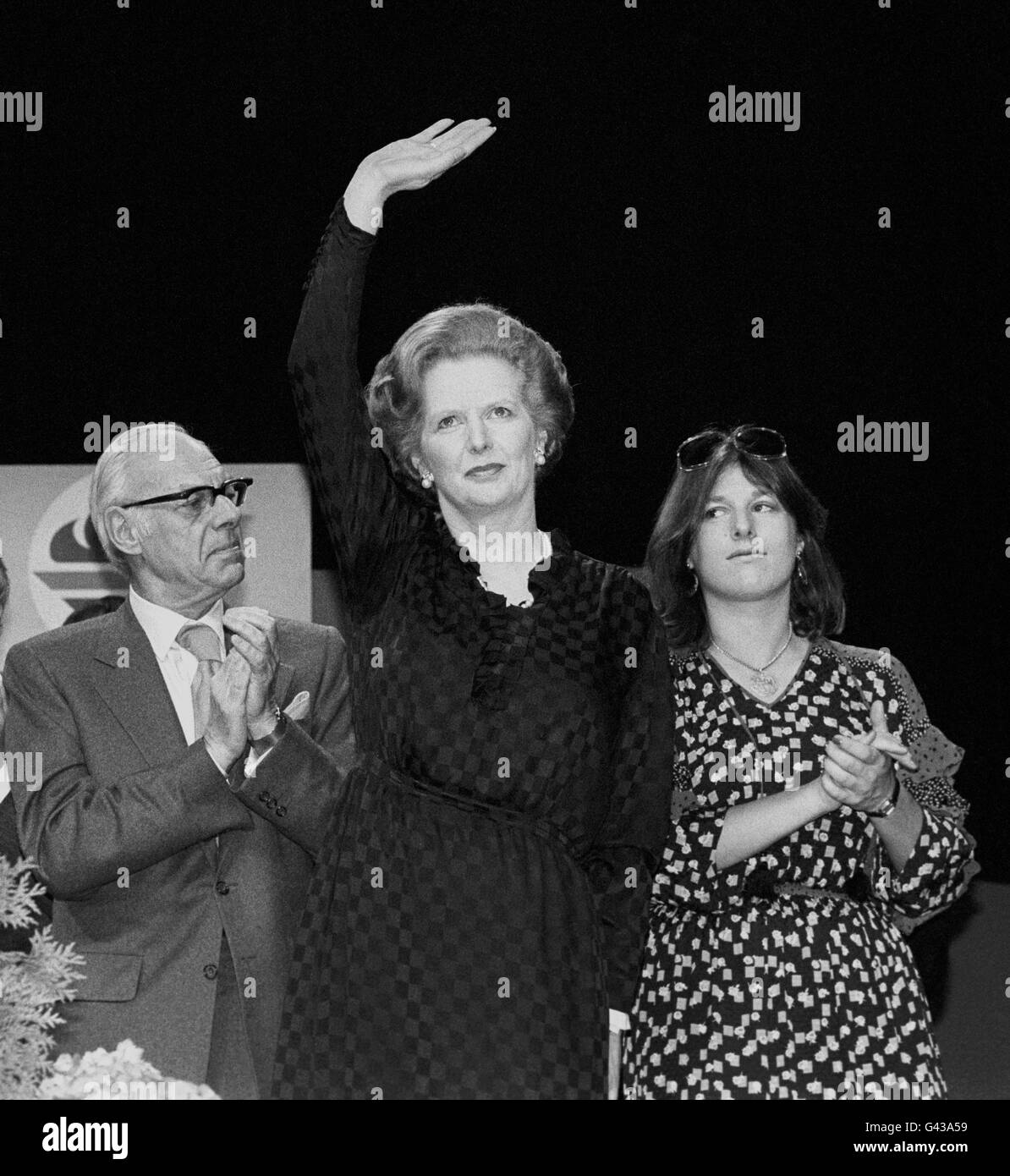 Prime Minister Margaret Thatcher, flanked by husband Denis and daughter Carol, during a Young Tories rally, in London. Stock Photo
