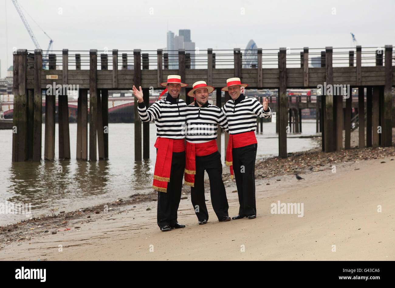 The Gondoliers (left to right) Michele Bozzato, Michael Malvich and Luca Foffano during a photocall as they sign a record deal with Universal Music - which will raise money and awareness for Venice in Peril, the fund working to save the Italian sinking city - on the South Bank in London. Stock Photo