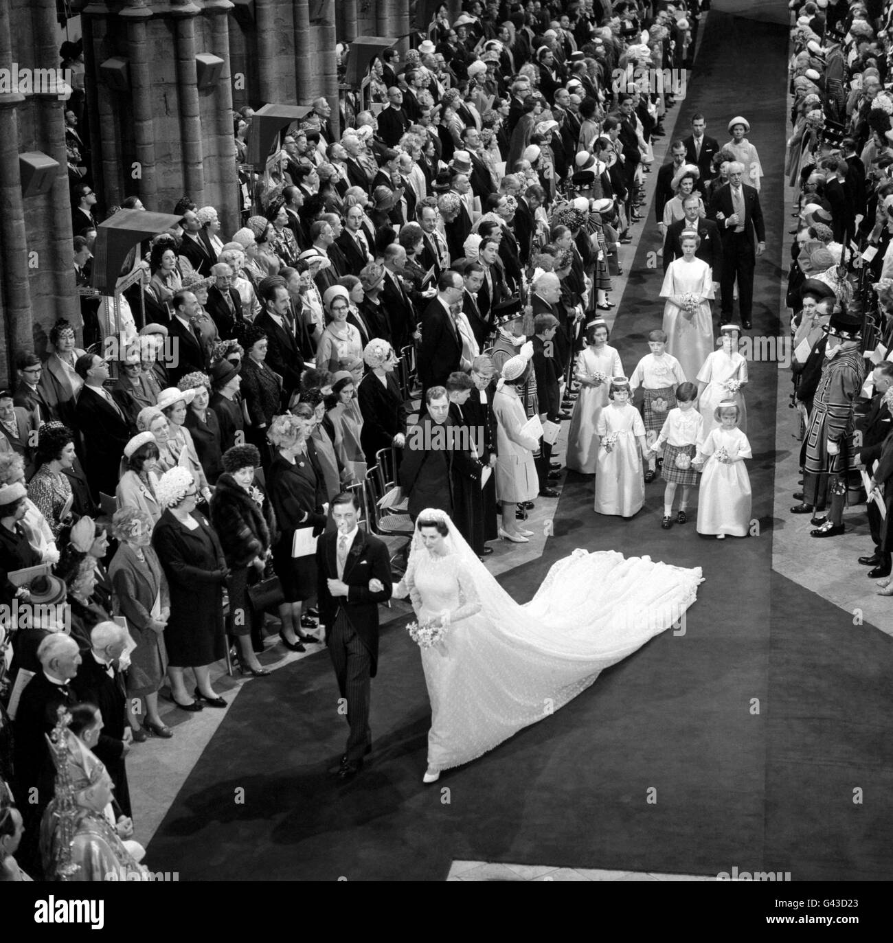 Princess Alexandra and her husband Angus Ogilvy, walking towards the West Door at the end of the royal wedding ceremony in Westminster Abbey Stock Photo