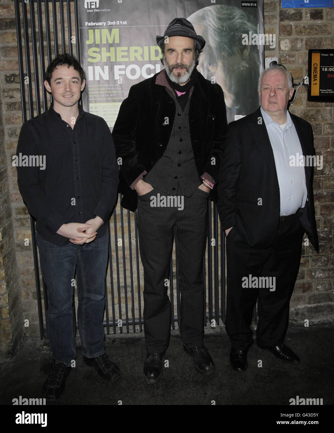 (left to right) Actors Hugh O'Connor and Daniel Day-Lewis and Director Jim Sheridan arrive at the IFI cinema in Dublin for a gala screening of My Left Foot, the opening film of the IFI's Jim Sheridan season. Stock Photo