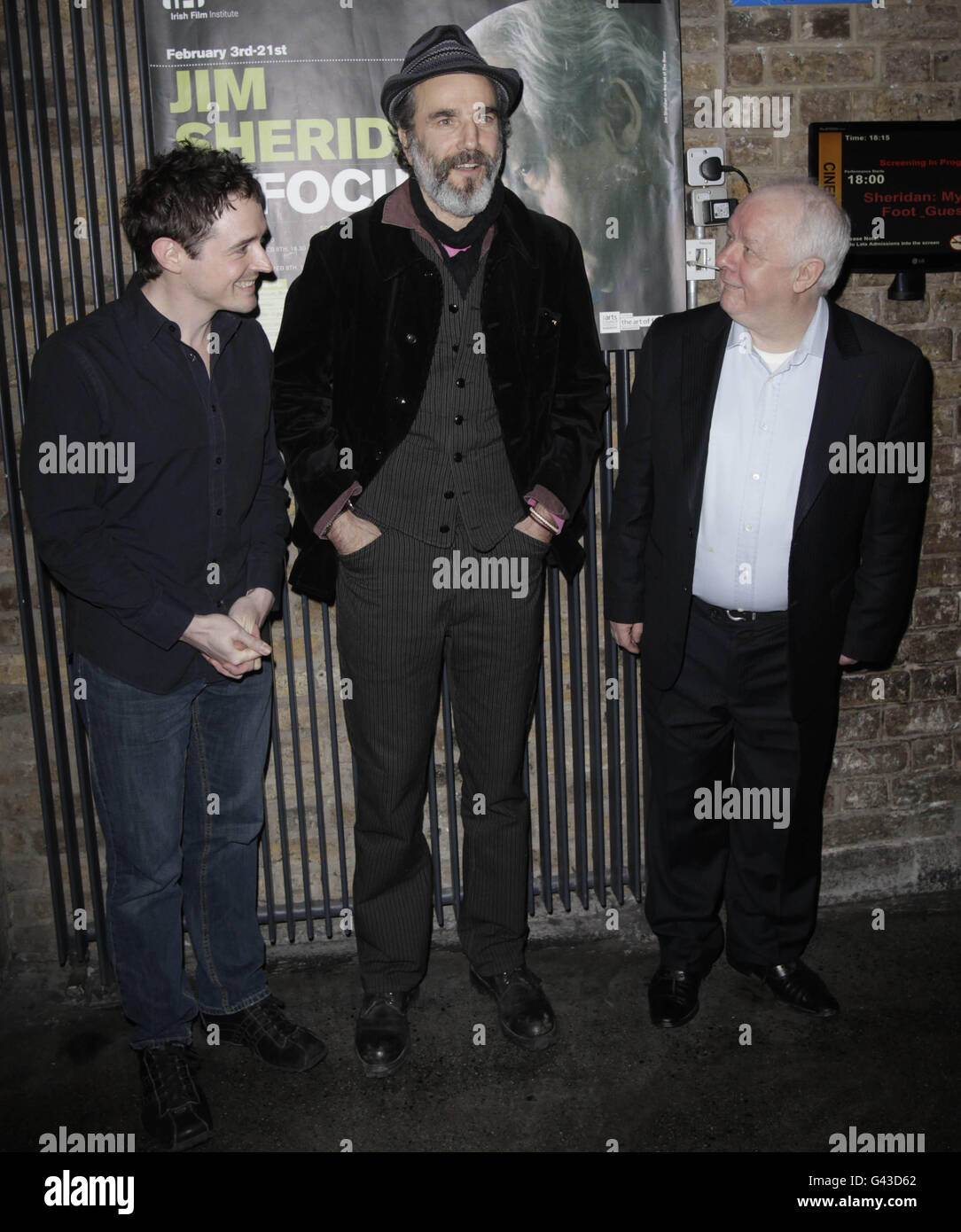 (left to right) Actors Hugh O'Connor and Daniel Day-Lewis and Director Jim Sheridan arrive at the IFI cinema in Dublin for a gala screening of My Left Foot, the opening film of the IFI's Jim Sheridan season. Stock Photo