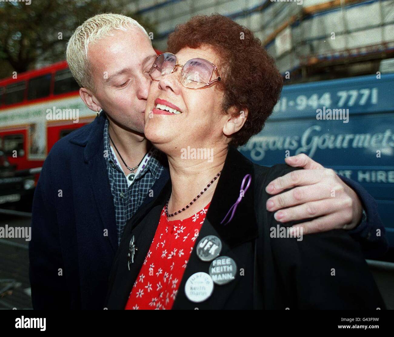 Mrs Doreen Mann gets a kiss from her son Anthony outside the Appeal Court in London, where her other son Keith had his fourteen year sentence to eleven years. Animal rights campaigner Keith was sentenced in 1994 after a firebombing campaign. Stock Photo