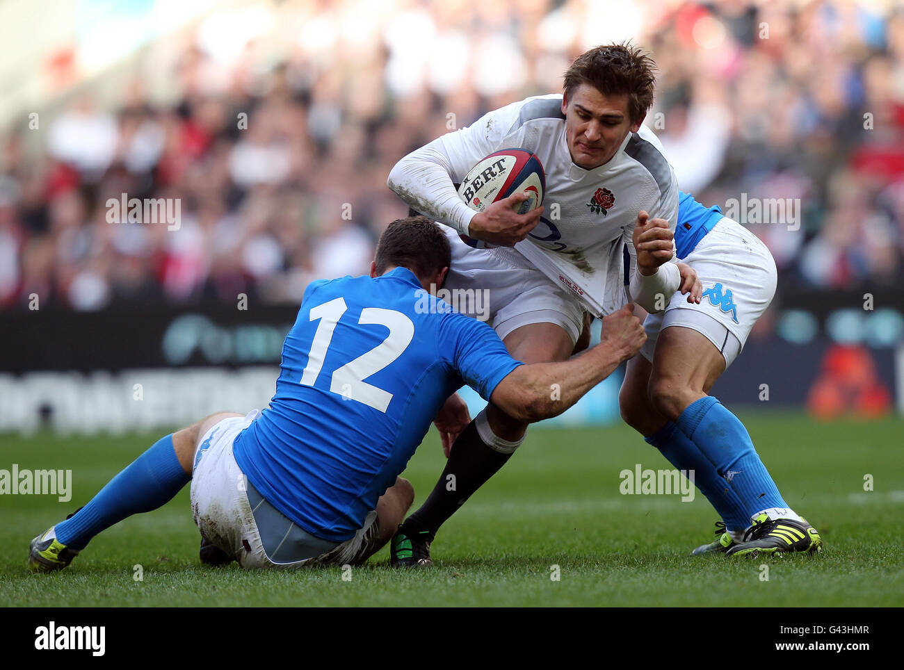 Rugby Union - RBS 6 Nations Championship 2011 - England v Italy - Twickenham. England's Toby Flood is tackled by Italy's Alberto Sgarbi during the RBS 6 Nations match at Twickenham, London. Stock Photo