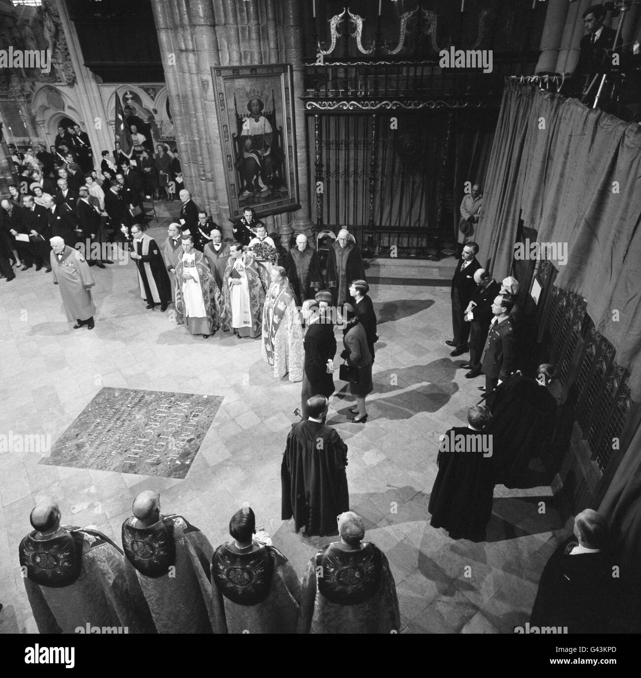 The Queen, Duke of Edinburgh, the Prince of Wales and Princess Anne near the memorial stone to Sir Winston Churchill in Westminster Abbe, as they were about the make their way in procession through the Nave and Choir to the Chapel of St Edward the Confessor where they celebrated the nonocentenary year of the consecration of the Abbey. Stock Photo