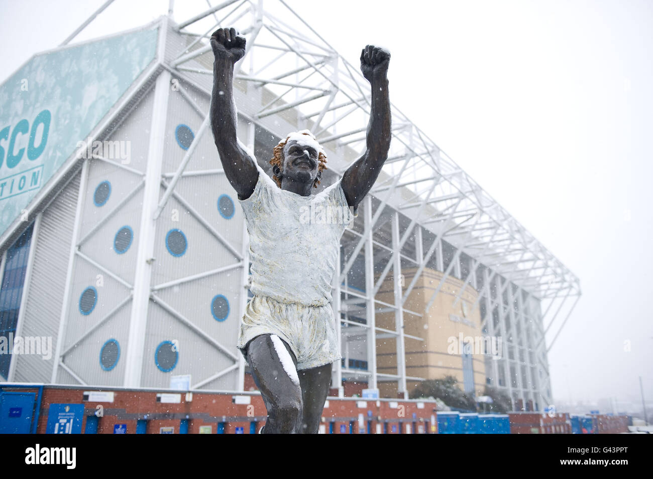 The Billy Bremner statue outside Elland Road stadium is covered in snow